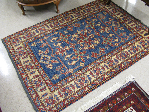 Appraisal: HAND KNOTTED ORIENTAL AREA RUG Pakistani-Caucasian stylized floral decoration on