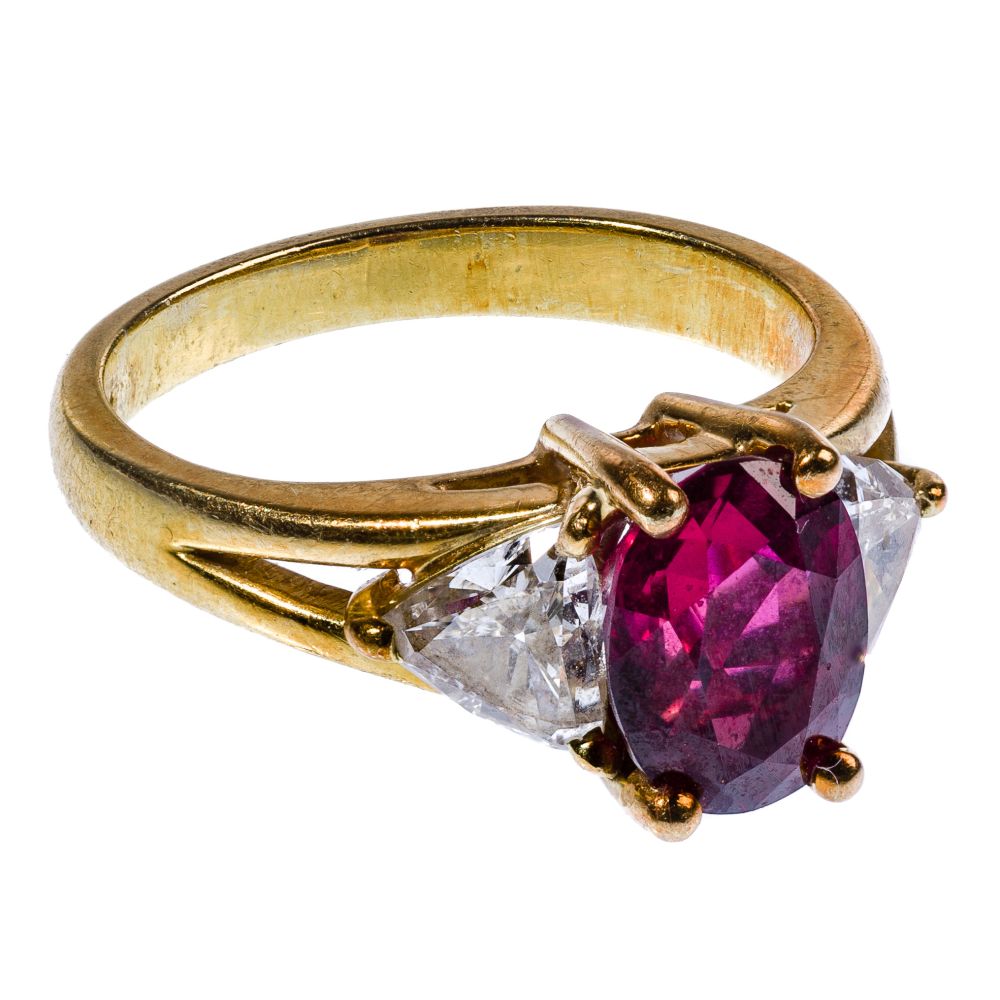 Appraisal: K YELLOW GOLD RUBY AND DIAMOND RINGHaving oval cut ruby