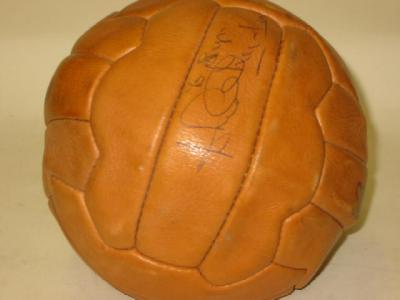 Appraisal: A leather football signed in ink by Jackie Charlton wide