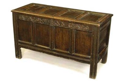 Appraisal: A late th century oak chest the quadruple panelled hinged