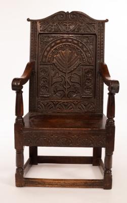 Appraisal: A Charles I walnut and oak wainscot chair the arch