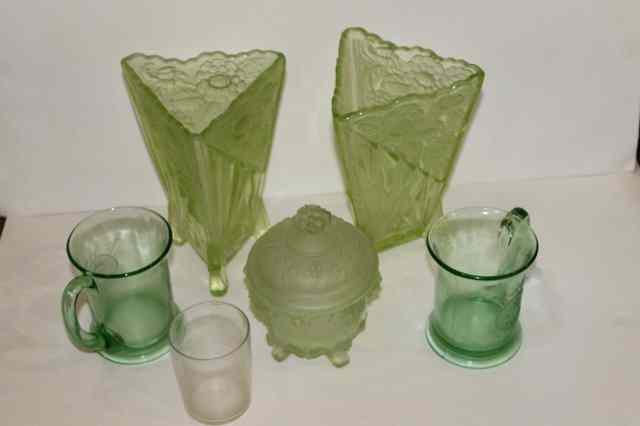 Appraisal: A PAIR OF 'S GREEN MOULDED GLASS VASES and four