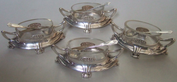 Appraisal: A set of four German twin handled Art Nouveau salts