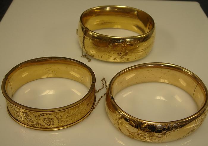 Appraisal: Gold-filled Bangle Bracelets Grouping of three wide hinged bangles various