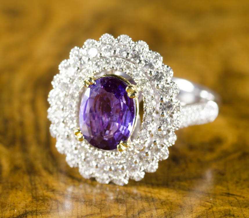 Appraisal: PURPLE SAPPHIRE DIAMOND AND EIGHTEEN KARAT GOLD RING with AIGS