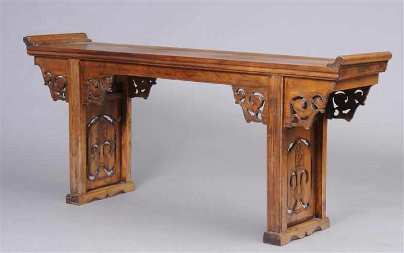 Appraisal: CHINESE ELMWOOD ALTAR TABLE The rectangular top with raised ends