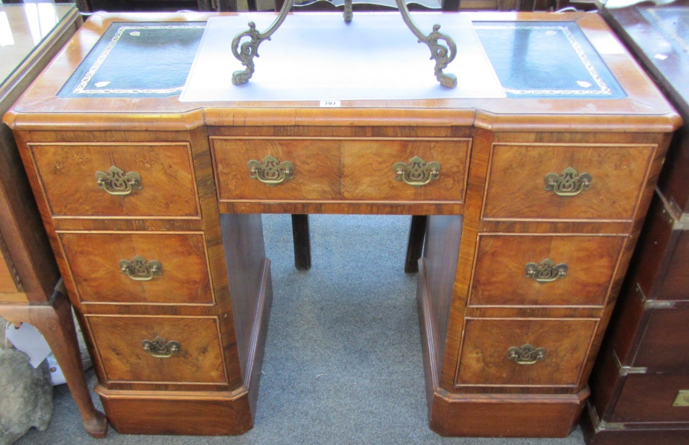 Appraisal: A th century walnut inverted breakfront kneehole writing desk with