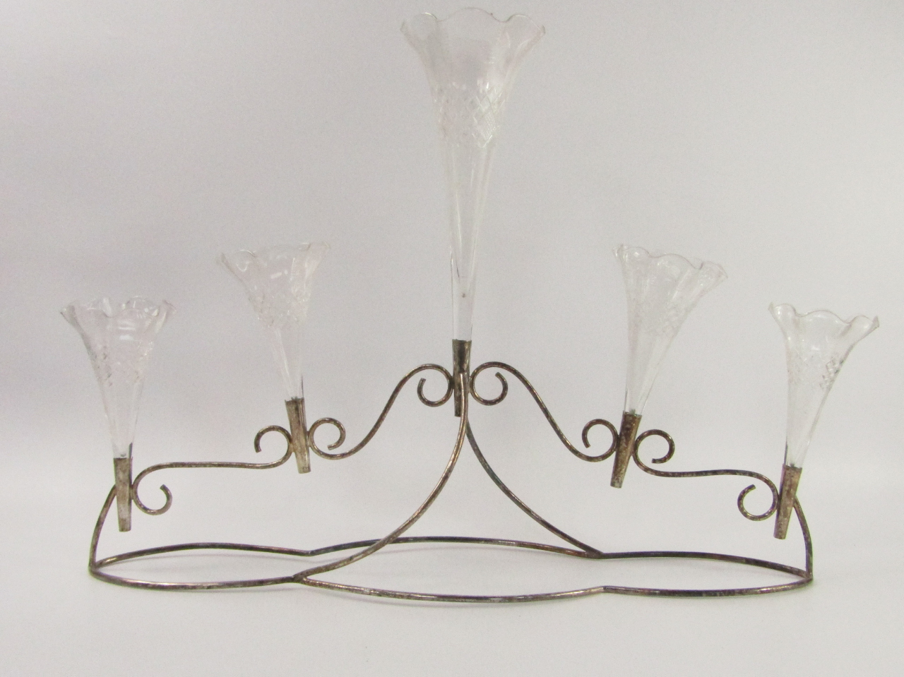 Appraisal: An Edwardian plated five branch epergne with cut glass trumpets