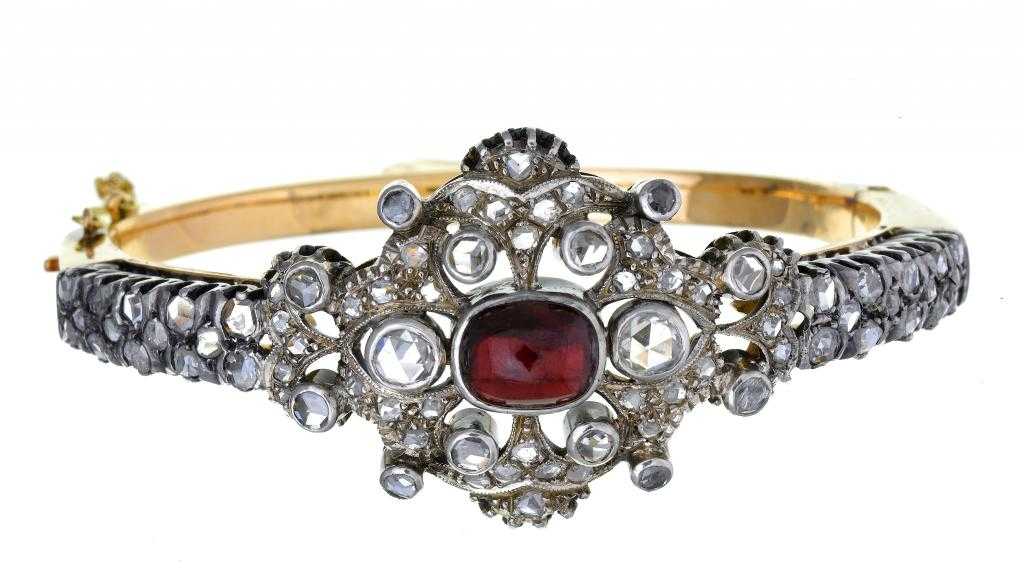 Appraisal: A RUBY AND DIAMOND BRACELET with central oblong ruby cabochon