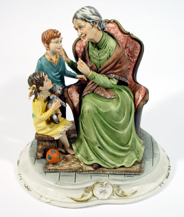 Appraisal: Hand painted Capo-di-Monte figure group granny with children artists signature