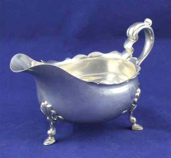 Appraisal: A George V silver sauceboat with cut rim and scroll