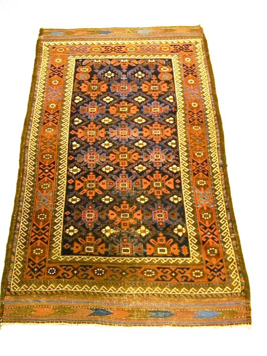 Appraisal: Antique Beluchistan scatter rug all-over flower head design blue field