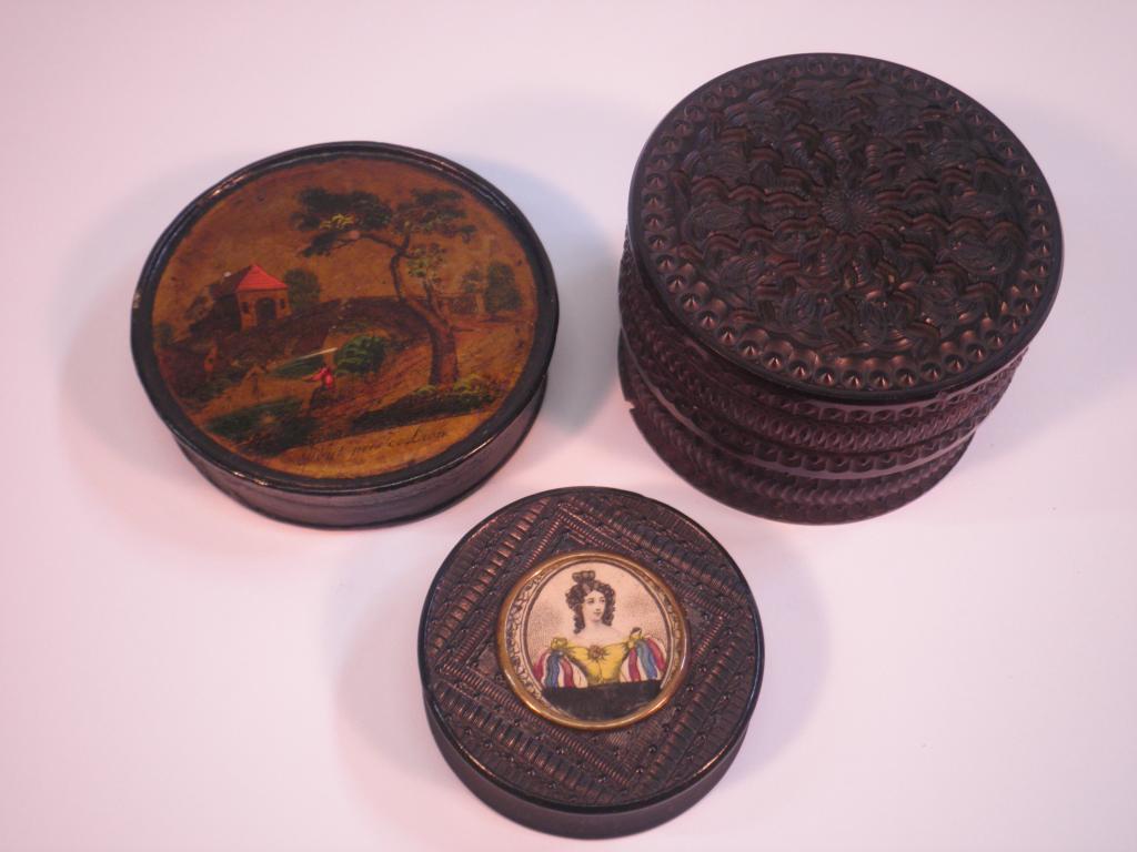 Appraisal: A thC carved and ebonised circular snuff box and cover