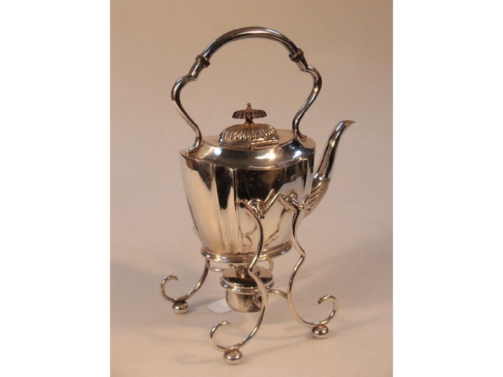 Appraisal: An early thC electroplated tea kettle with a fixed overhead