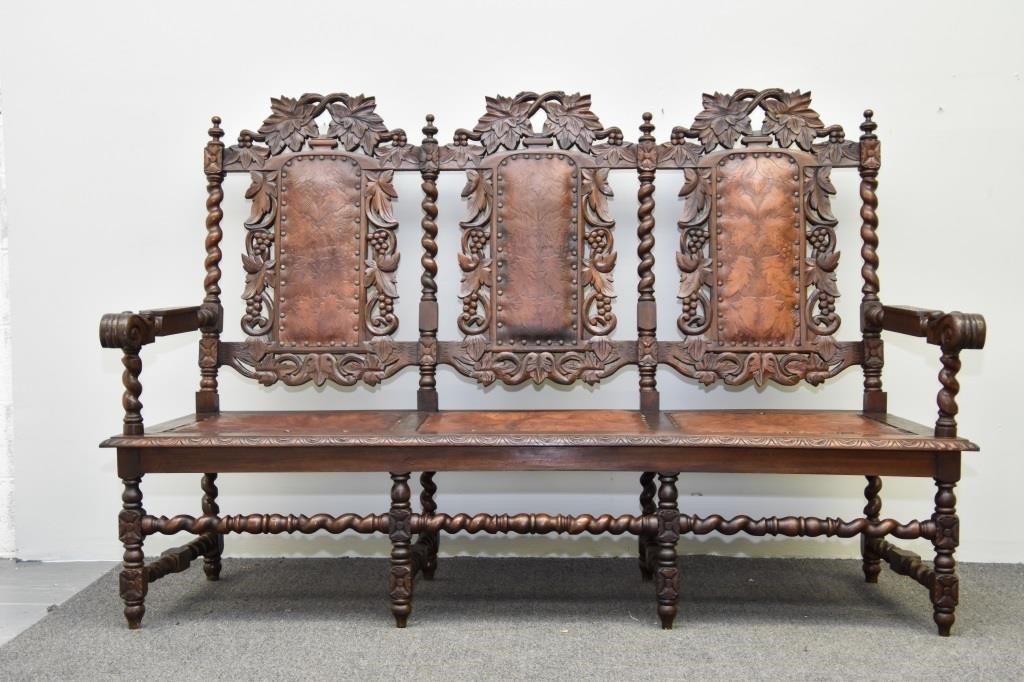 Appraisal: Jacobean style walnut settle circa with tooled leather seating and