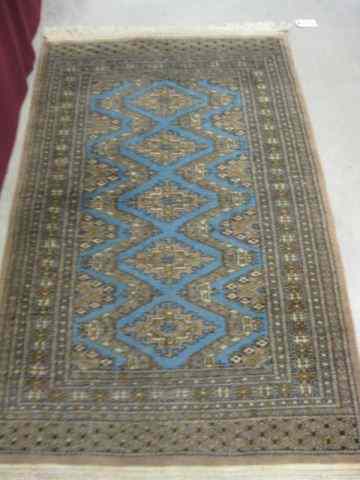 Appraisal: Belouchi Handmade Rug blue geometric designs on grey field '