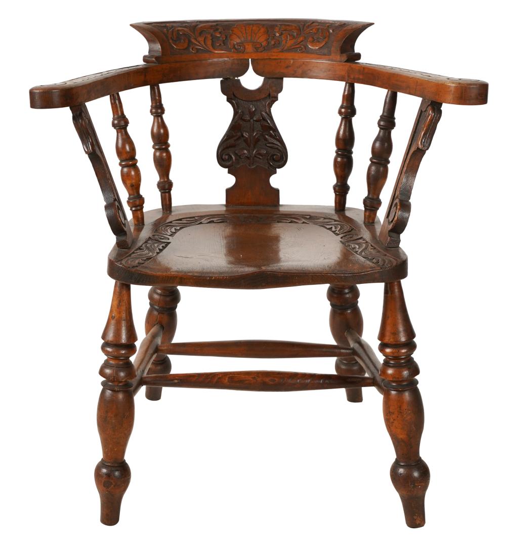 Appraisal: CARVED OAK BARREL-BACK CHAIRthe crest rail arms and seat carved