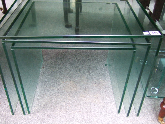 Appraisal: A glass square occasional table with four glass pane supports