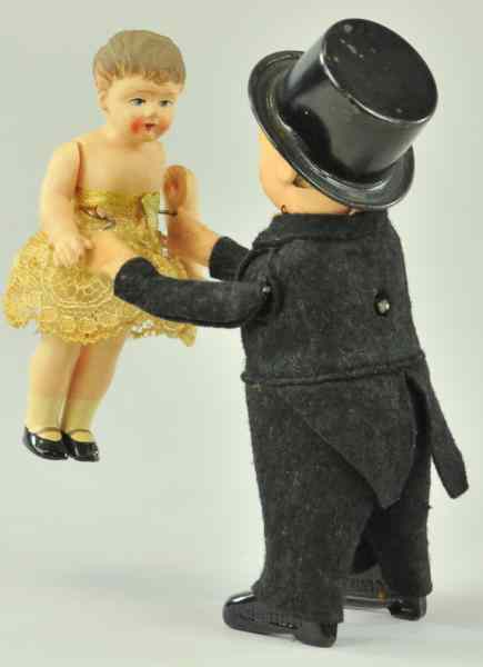 Appraisal: SCHUCO DANCING BOY WITH GIRL Germany boy dressed in black