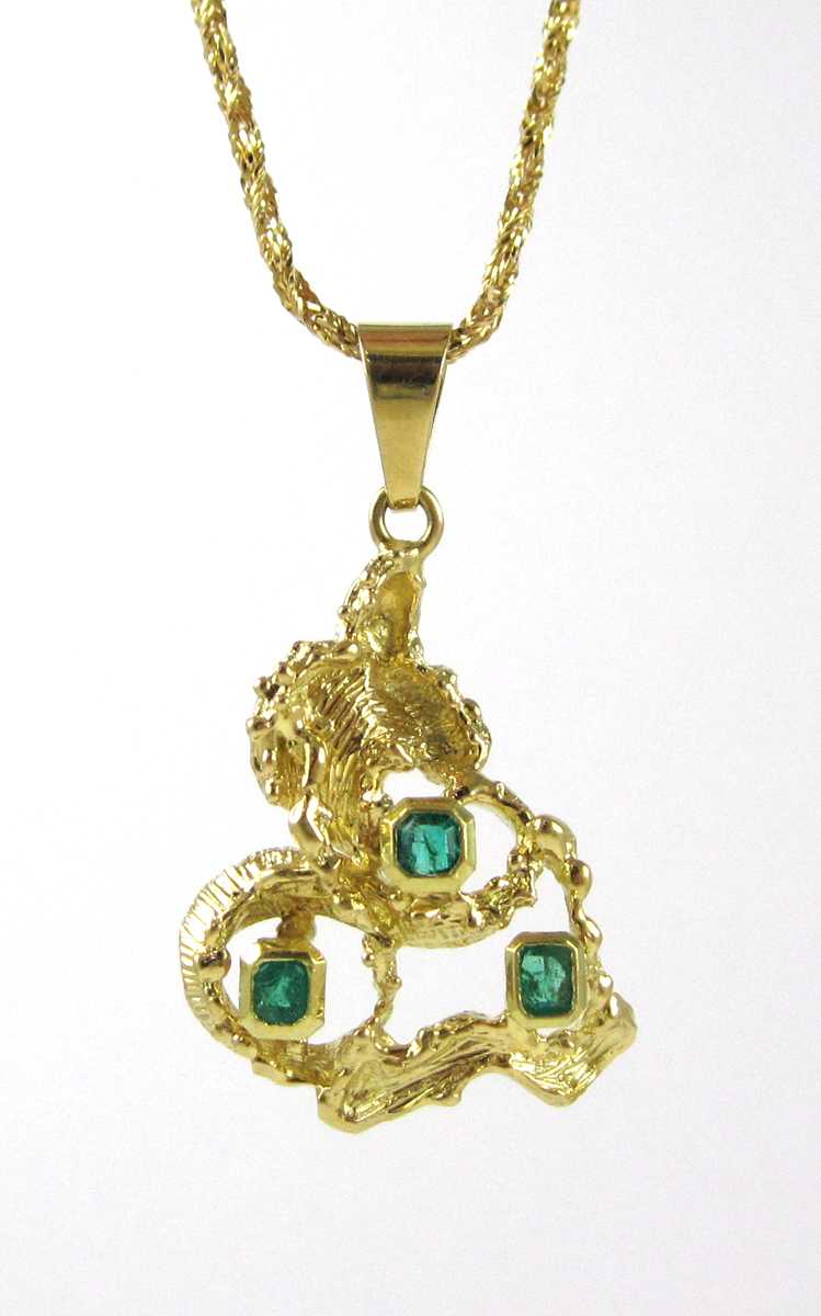 Appraisal: EMERALD AND YELLOW GOLD PENDANT NECKLACE with a - inch