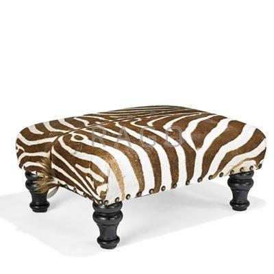 Appraisal: ZEBRA SKIN OTTOMAN Ebonized turned legs th c x x