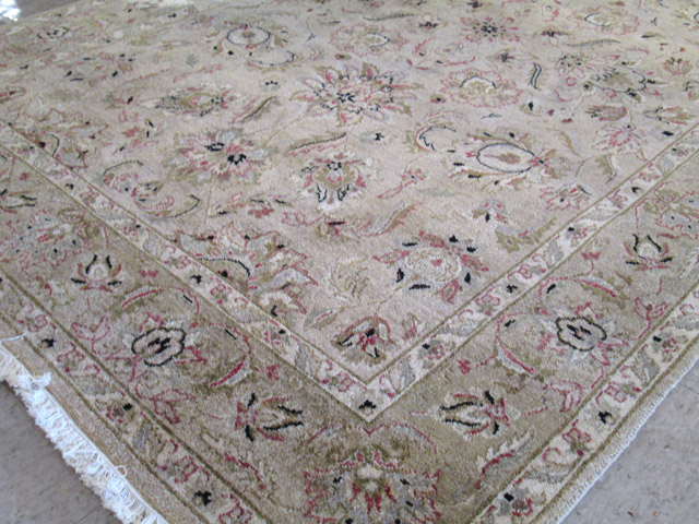 Appraisal: HAND KNOTTED ORIENTAL CARPET Indo-Persian overall floral decoration on light