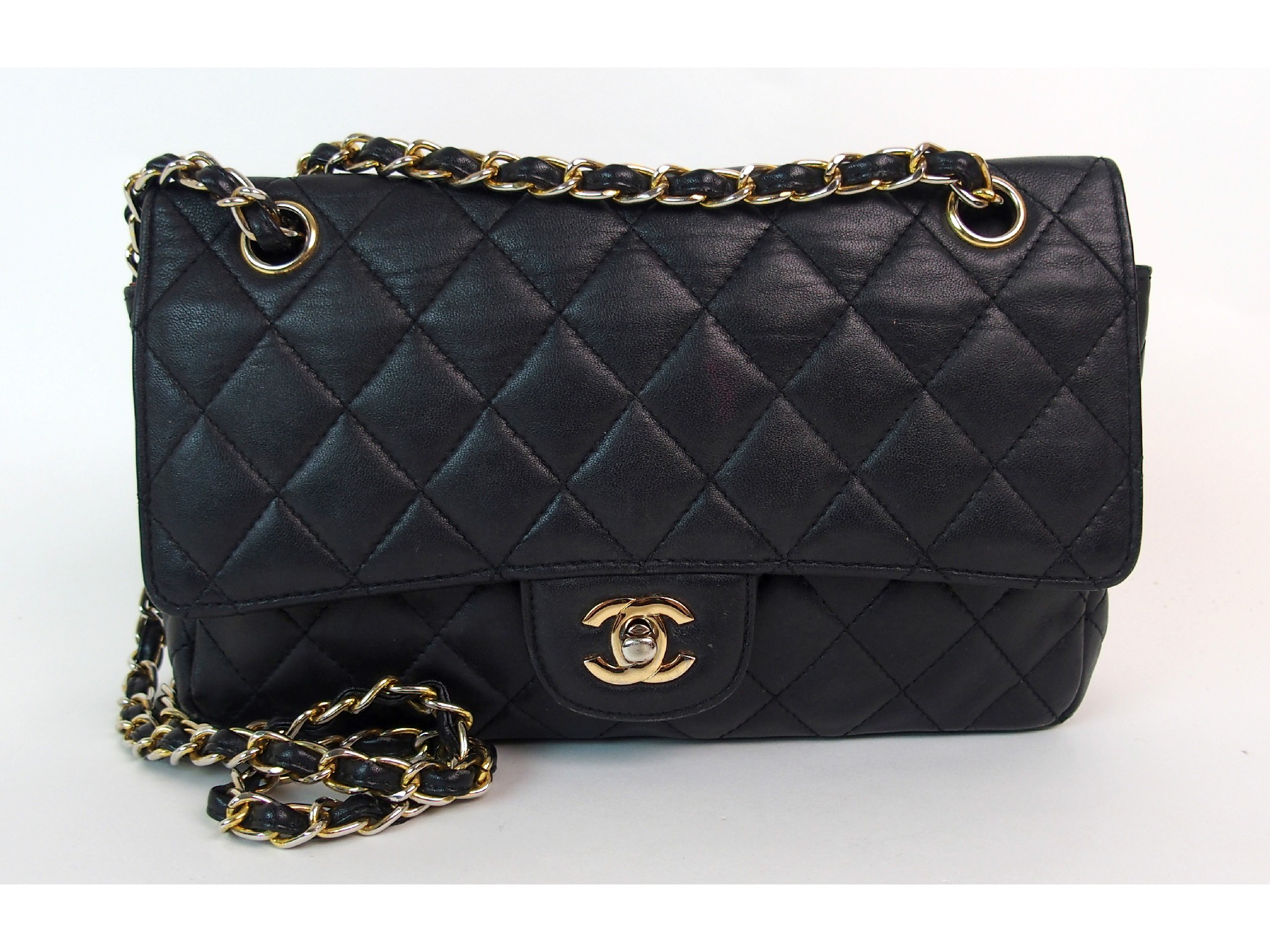 Appraisal: A Chanel black quilted leather handbagred leather interior embossed with