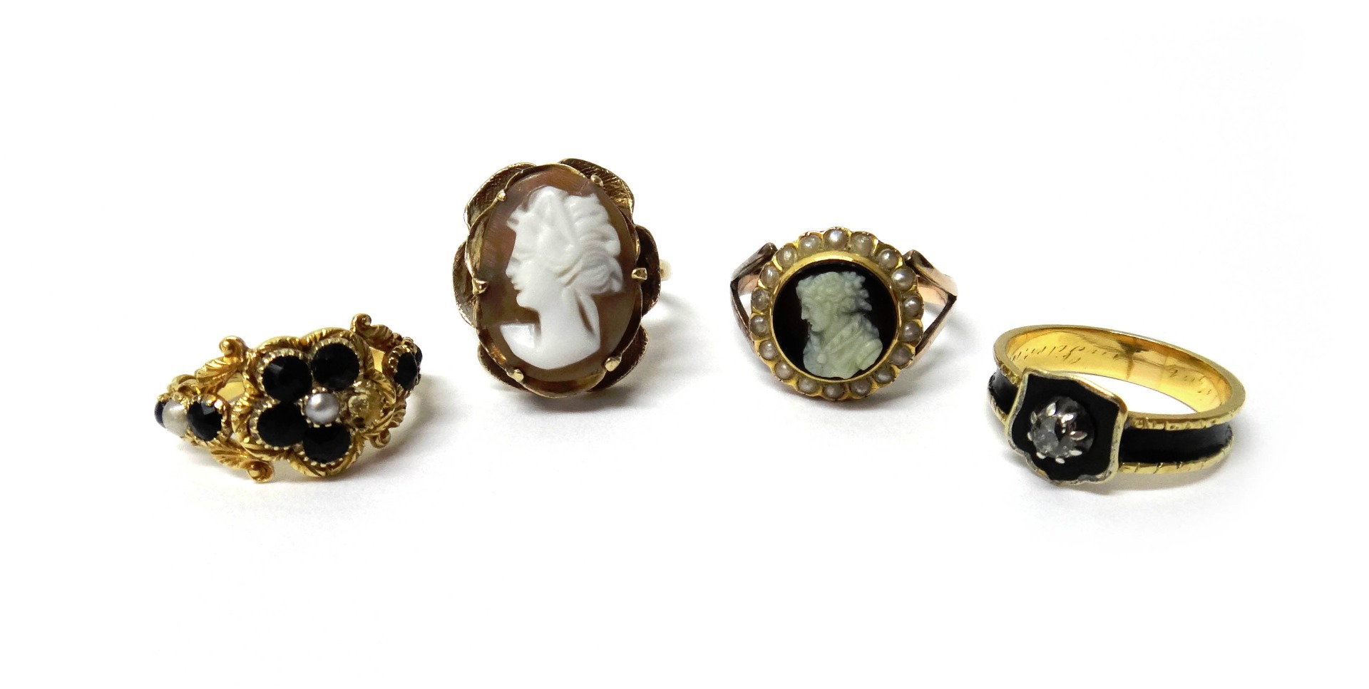 Appraisal: A gold carved agate and seed pearl set ring carved