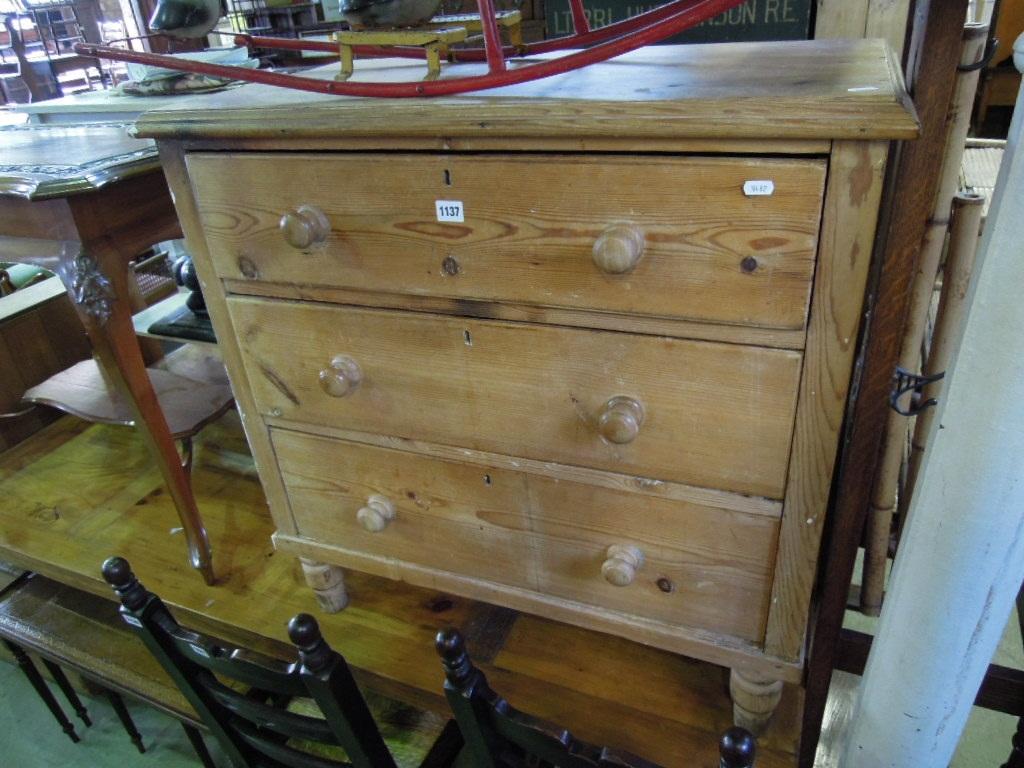 Appraisal: A small Victorian pine chest fitted with three long drawers