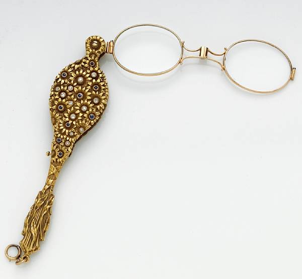 Appraisal: A diamond and sapphire lorgnette with case mounted in fourteen