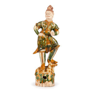 Appraisal: A Monumental Chinese Sancai Warrior Figure standing figure on shaped