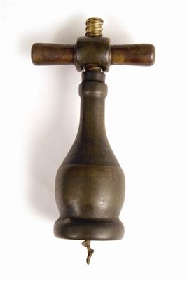 Appraisal: An Italian bronzed wine bottle corkscrew with swivel over collar