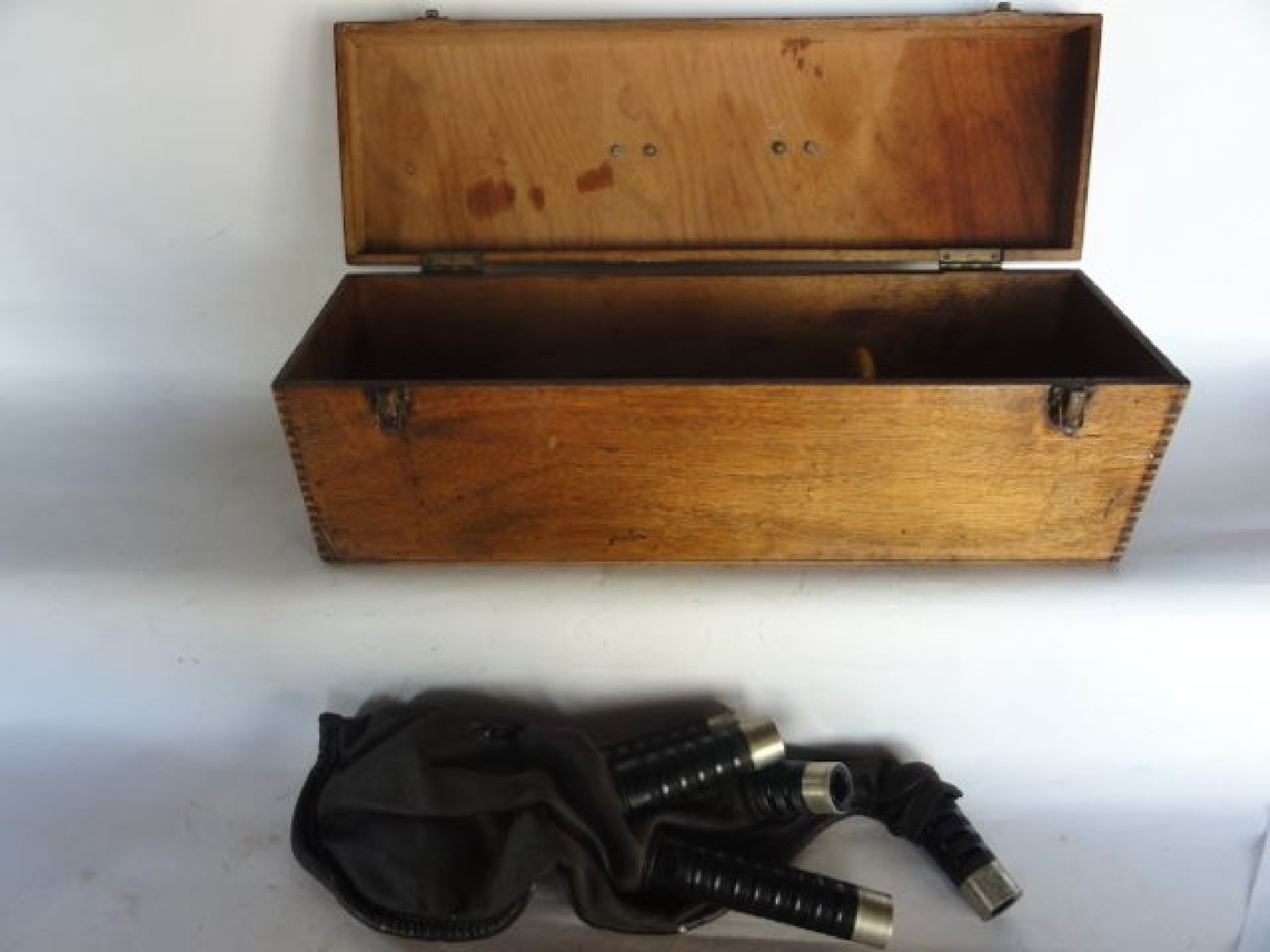 Appraisal: A hinged timber box containing a set of leather bagpipes