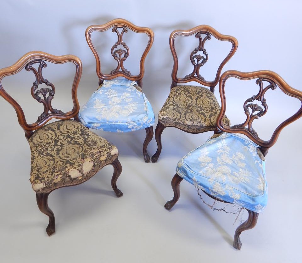 Appraisal: A set of four Victorian walnut balloon back chairs each