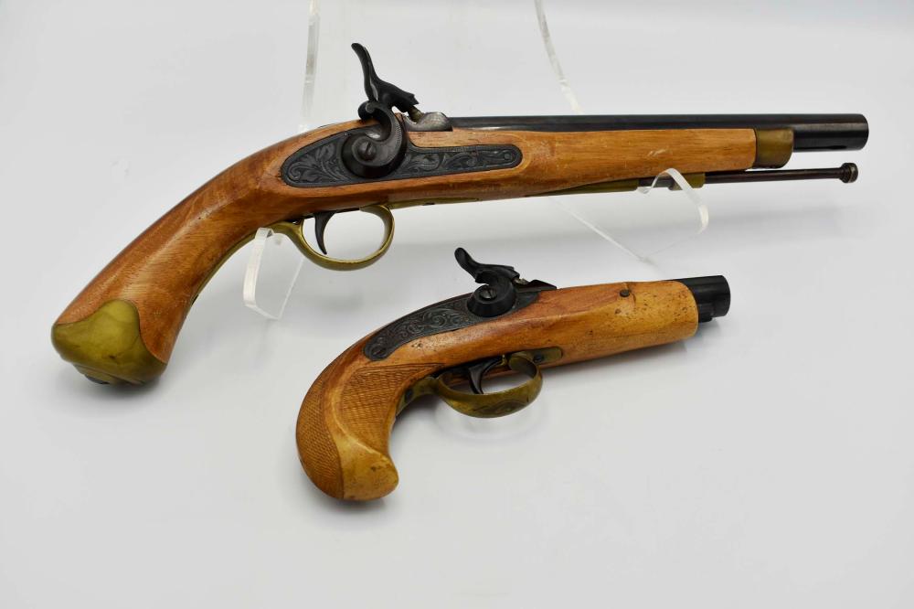 Appraisal: TWO EUROPEAN METAL-MOUNTED WALNUT PISTOLSEach stock with an etched steel