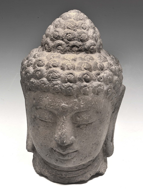 Appraisal: A LARGE STONE HEAD OF JINA OR BUDDHA possibly Indonesian