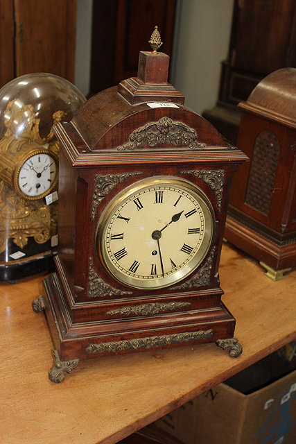 Appraisal: A MAHOGANY MANTEL TIMEPIECE having a painted Roman dial and