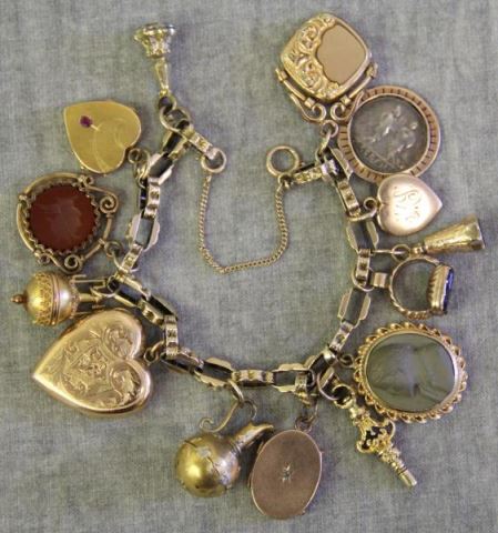 Appraisal: JEWELRY Antique kt Gold Charm Bracelets Total of charms including