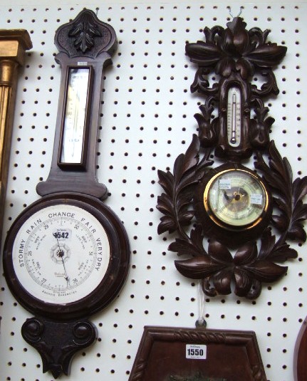 Appraisal: A 's Aneroid wheel barometer and one other heavily carved