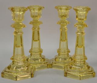 Appraisal: Set of four sandwich glass candlesticks amber color six sided