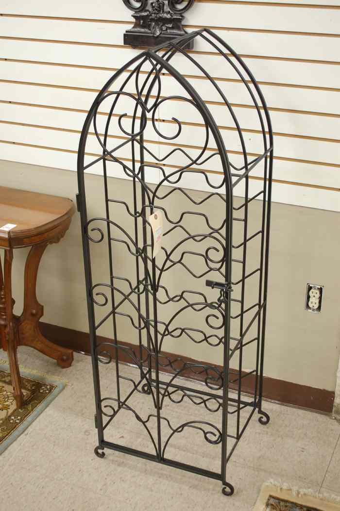 Appraisal: WROUGHT IRON WINE RACK floor model with arch top space