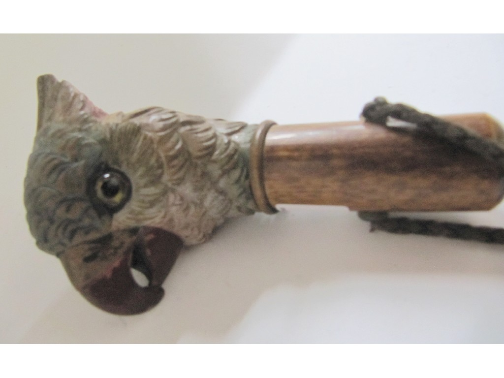 Appraisal: A carved wood cane handle modelled as a cockatoo's head