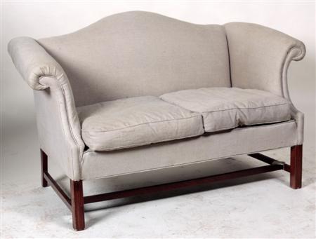 Appraisal: A George III style two seater sofa the arched back