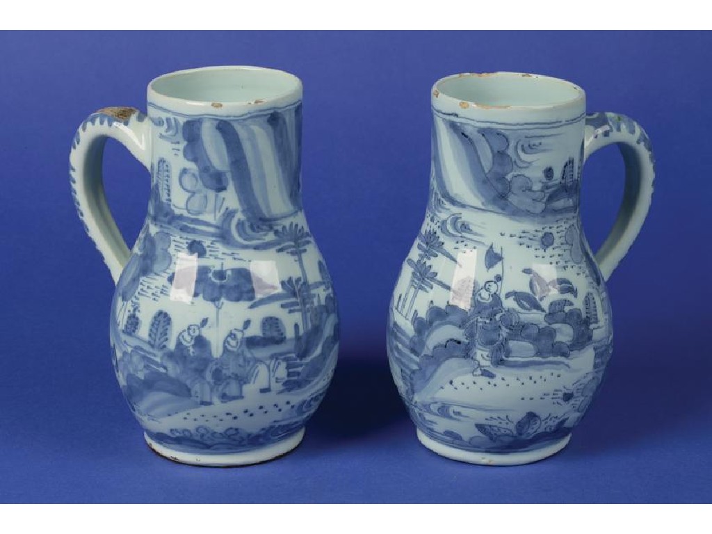 Appraisal: A PAIR OF DELFTWARE BLUE AND WHITE FLAGONS decorated in