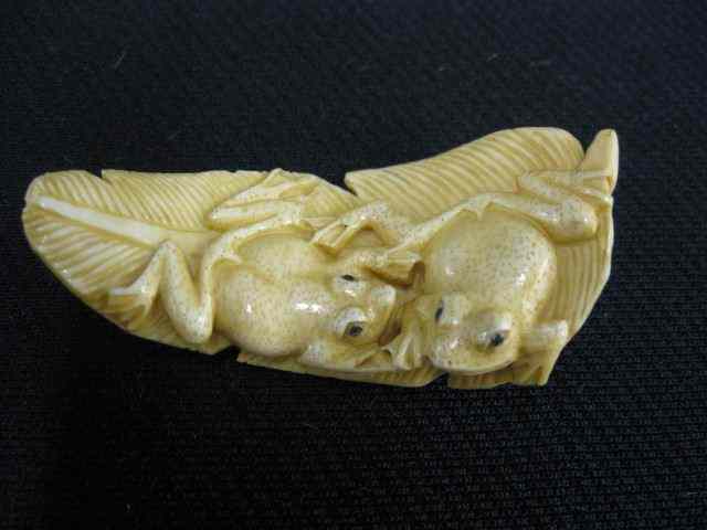 Appraisal: Carved Ivory Netsuke of Two Frogs on a leaf ''