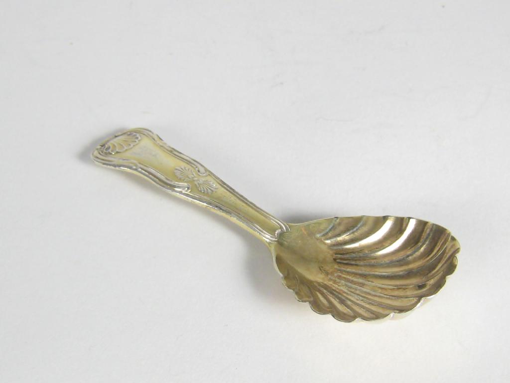 Appraisal: A George III silver-gilt Caddy Spoon with scallop bowl kings