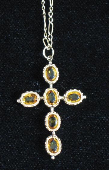 Appraisal: A CITRINE CROSS PENDANT formed from oval cushion-cut citrines in