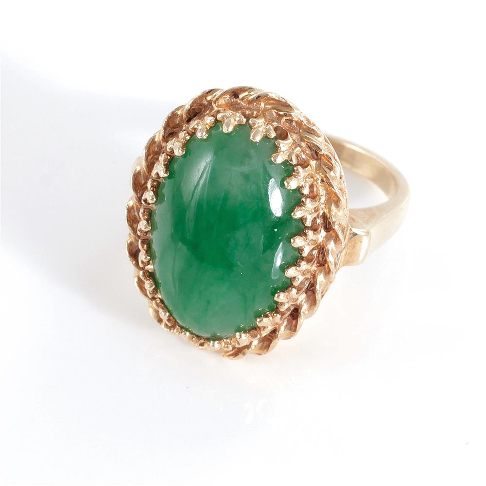 Appraisal: Jade and gold ring approx x mm oval cabochon jade