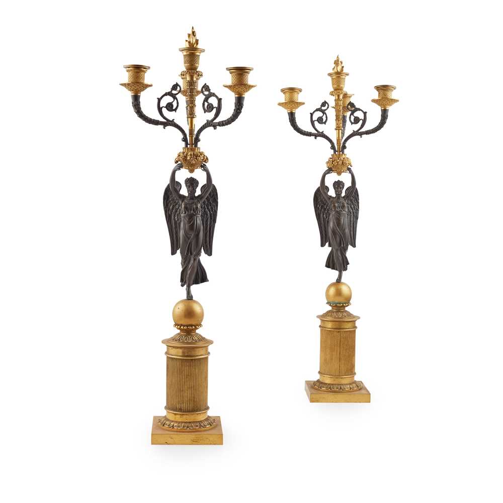 Appraisal: PAIR OF FRENCH EMPIRE GILT AND PATINATED BRONZE FIGURAL CANDELABRA