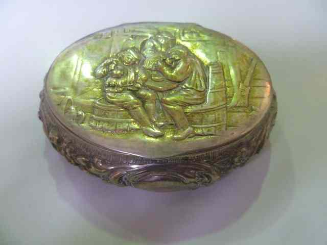 Appraisal: A CONTINENTAL WHITE METAL TOBACCO BOX of oval form with